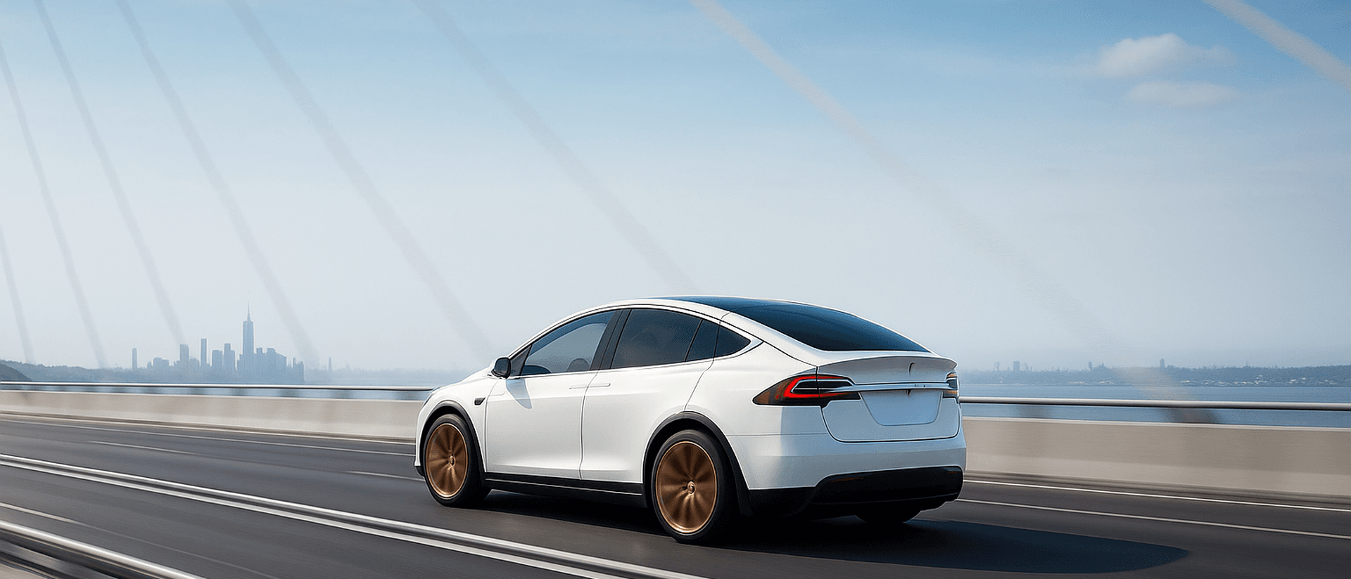 Tesla crossing a modern bridge toward the island